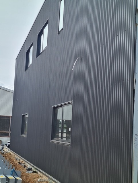 Dark metal cladding on commercial building